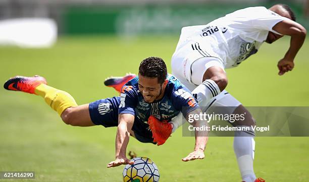 Jean Mota of Santos fights for the ball with Joao Vitor of Ponte Preta during the match between Ponte Preta and Santos for the Brazilian Series A...