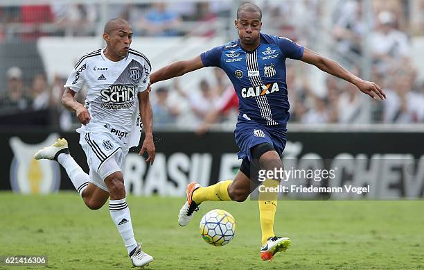 Jean Mota of Santos fights for the ball with Nino Paraiba of Ponte Preta during the match between Ponte Preta and Santos for the Brazilian Series A...
