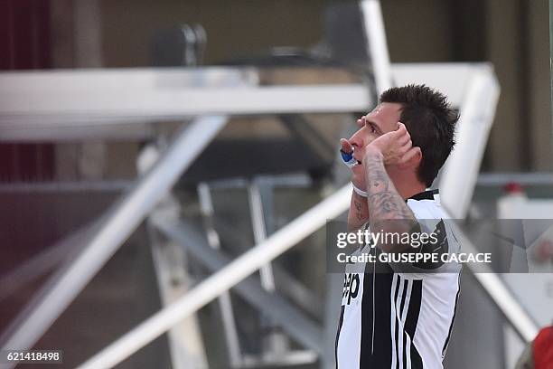 Juventus' forward from Croatia Mario Mandzukic celebrates after scoring during the Italian Serie A football match Chievo Verona vs Juventus at...