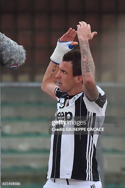 Juventus' forward from Croatia Mario Mandzukic celebrates after scoring during the Italian Serie A football match Chievo Verona vs Juventus at...