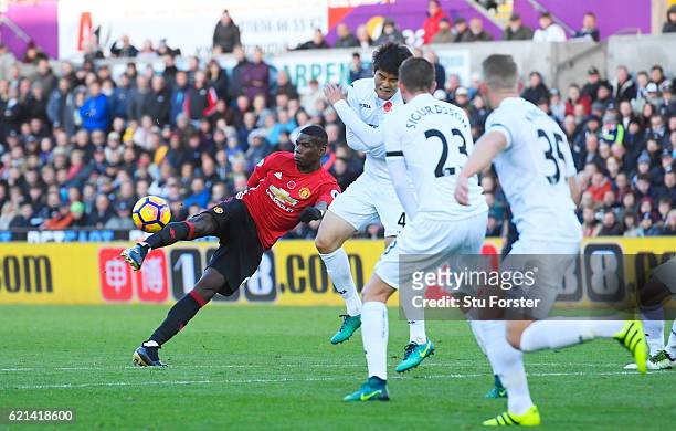 Paul Pogba of Manchester United scores his sides first goal during the Premier League match between Swansea City and Manchester United at Liberty...