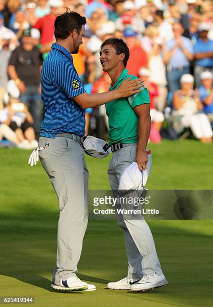 Bernd Wiesberger of Austria congratulated Thorbjorn Olesen of Denmark after wnning the Turkish Airlines Open at the Regnum Carya Golf & Spa Resort on...