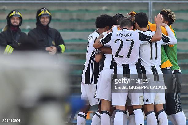 Juventus' midfielder from Bosnia Miralem Pjanic celebrates with teammates after scoring during the Italian Serie A football match Chievo Verona vs...