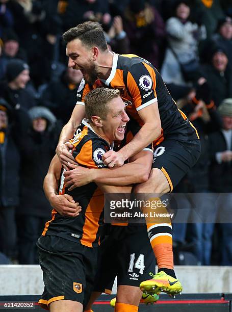 Michael Dawson of Hull City celebrates scoring his sides second goal with Robert Snodgrass of Hull City during the Premier League match between Hull...