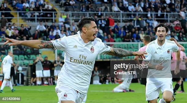 Milan's forward Gianluca Lapadula celebrates with AC Milan's defender from Italy Alessio Romagnoli after scoring during the Italian Serie A football...