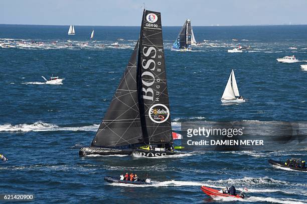 English skipper Alex Thomson sails onboard his class Imoca monohull "Hugo Boss" sails after the start of the Vendee Globe solo around-the-world...