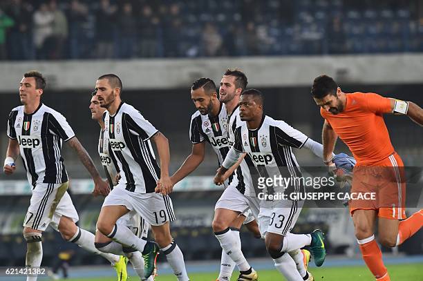 Juventus' team players celebrate at the end of the Italian Serie A football match Chievo Verona vs Juventus at "Bentegodi Stadium" in Verona on...