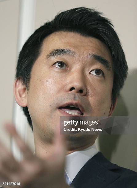 Japan - Osaka Mayor Toru Hashimoto answers reporters' questions at Osaka city hall in western Japan on May 24, 2013. Two South Korean women who were...