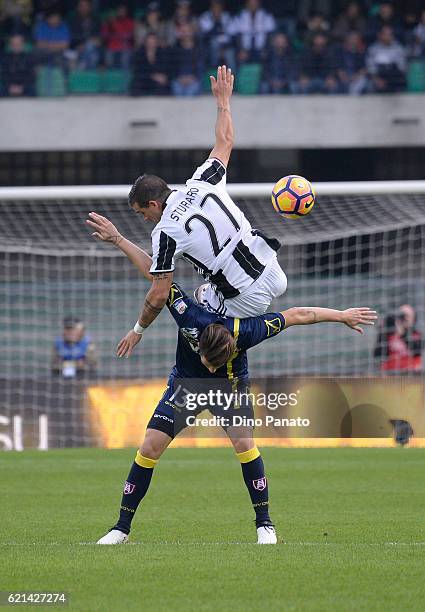 Stefano Sturaro of Juventus FC his challenged to Mariano Izco of AC ChievoVerona during the Serie A match between AC ChievoVerona and Juventus FC at...