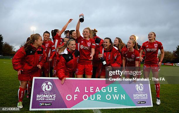 The players of Bristol City Women celebrate their promotion to WSL1 during the FA WSL 2 match between Oxford United Women FC v Bristol City Women FC...