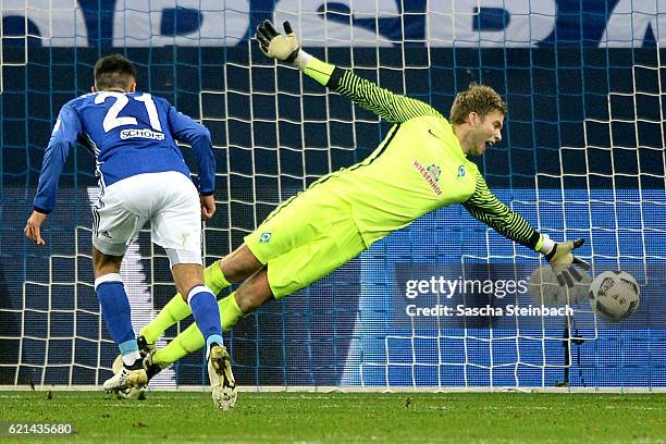 Alessandro Schoepf of Schalke scores the opening goal by a header against goalkeeper Felix Wiedwald of Bremen during the Bundesliga match between FC...