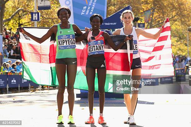 First-place finisher Mary Keitany of Kenya, second-place finisher Sally Kipyego of Kenya and third-place finisher Molly Huddle of the United States...