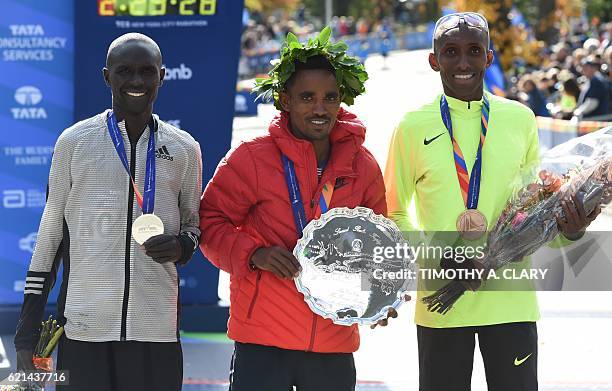 First place winner Ghirmay Ghebreslassie of Eritrea 2nd place finisher Lucas Rotich from Kenya and third place finisher Abdi Abdirahman from the US...