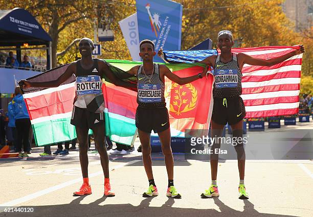 First-place finisher Ghirmay Ghebreslassie of Eritrea, second-place finisher Lucas Rotich of Kenya and third-place finisher Abdi Abdirahman of the...