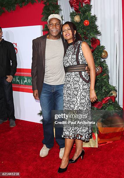 Actor Danny Glover and his Wife Elaine Cavalleiro attend the premiere of "Almost Christmas" at Regency Village Theatre on November 3, 2016 in...