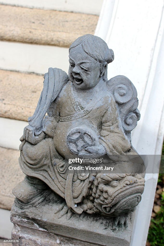 Statue on staircase Wat Sommanat Wihan temple Bangkok Thailand