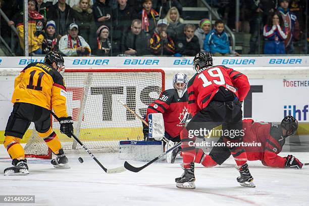Marco Nowak tries to score against Goalie Danny Taylor during the Deutschland Cup between Germany and Canada on November 06 at Curt Frenzel Stadium...