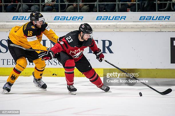 Andrew Gordon vies with Konrad Abeltshauser during the Deutschland Cup between Germany and Canada on November 06 at Curt Frenzel Stadium in Augsburg,...
