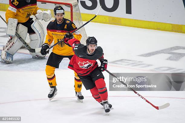 Bud Holloway vies with Sinan Akdag during the Deutschland Cup between Germany and Canada on November 06 at Curt Frenzel Stadium in Augsburg, Germany.