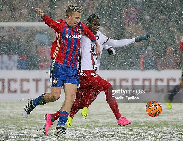 Pontus Wernbloom of PFC CSKA Moscow challenged by Fegor Ogude of FC Amkar Perm during the Russian Premier League match between PFC CSKA Moscow and FC...