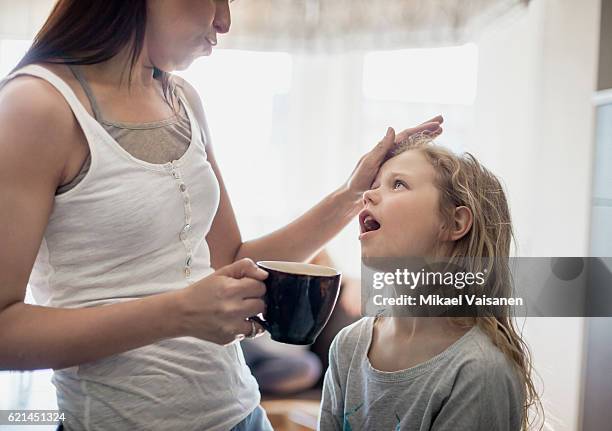 portrait of mother consoling her young daughter - pleading stock pictures, royalty-free photos & images