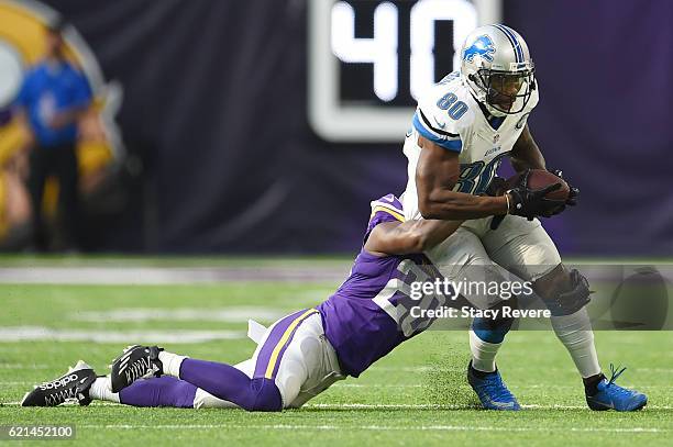 Anquan Boldin of the Detroit Lions is brought down by Mackensie Alexander of the Minnesota Vikings during the first half of the game on November 6,...