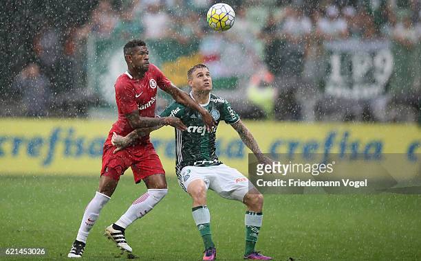 Roger Guedes of Palmeiras fights for the ball with Paulao of Internacional during the match between Palmeiras and Internacional for the Brazilian...