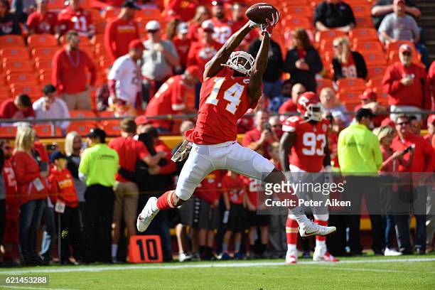 Wide receiver Demarcus Robinson of the Kansas City Chiefs catches a pass during warm ups before the game against the Jacksonville Jaguars at...