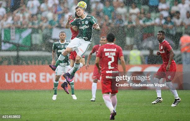 Roger Guedes of Palmeiras fights for the ball with Rodrigo Dourado of Internacional during the match between Palmeiras and Internacional for the...