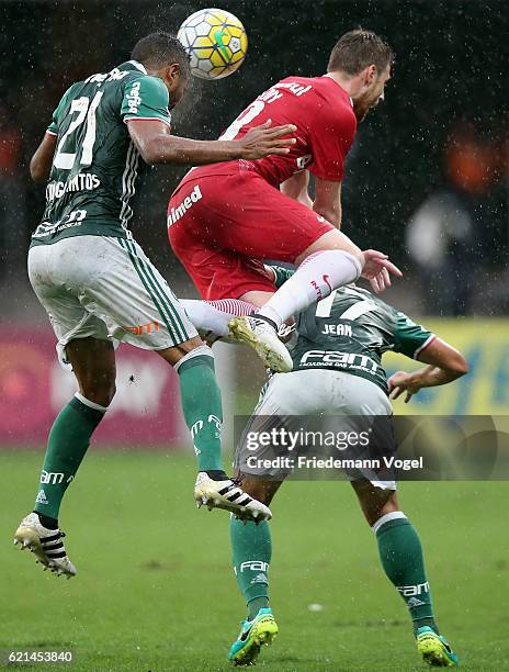 Thiago Santos ans Jean of Palmeiras fights for the ball with Aylon of Internacional during the match between Palmeiras and Internacional for the...