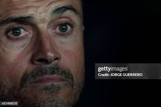 Barcelona's coach Luis Enrique looks on before the Spanish league football match Sevilla FC vs FC Barcelona at the Ramon Sanchez Pizjuan stadium in...