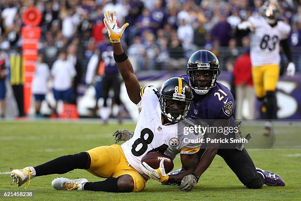 Wide receiver Antonio Brown of the Pittsburgh Steelers celebrates after scoring a fourth quarter touchdown while free safety Lardarius Webb of the...