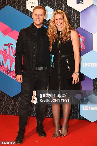 Netherlands' DJ Armin van Buuren and wife Erika van Thiel pose at the MTV Europe Music Awards on November 6, 2016 at the Ahoy Rotterdam in Rotterdam....
