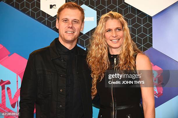 Netherlands' DJ Armin van Buuren and wife Erika van Thiel pose at the MTV Europe Music Awards on November 6, 2016 at the Ahoy Rotterdam in Rotterdam....