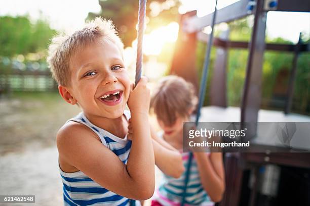 kinder lachen auf dem spielplatz - children playground stock-fotos und bilder