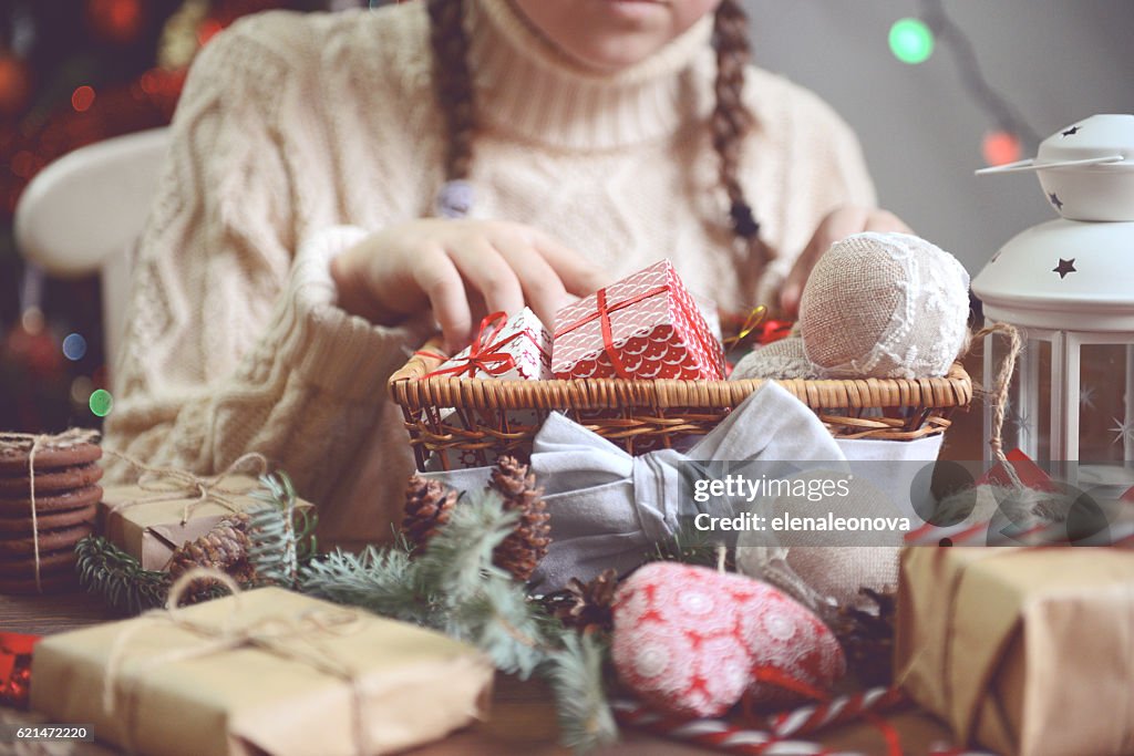 Girl making Christmas presents