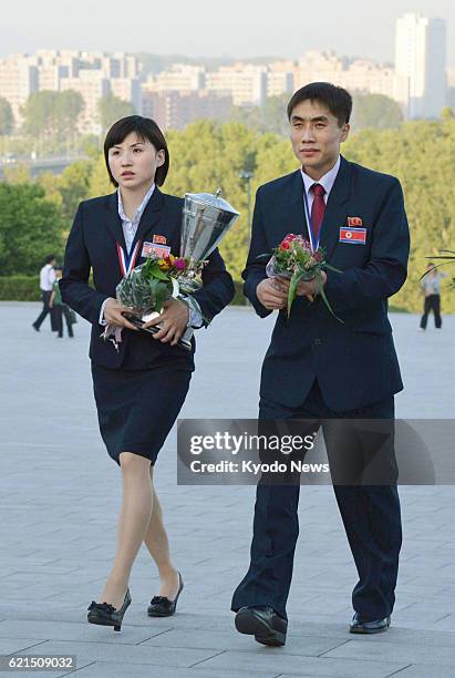 North Korea - North Korean table tennis players Kim Hyok Bong and Kim Jong head for the Mansu Hill in Pyongyang to offer flowers on May 30 after they...