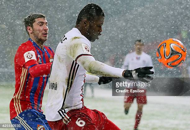 Alexey Ionov of PFC CSKA Moscow challenged by Sekou Conde of FC Amkar Perm during the Russian Premier League match between PFC CSKA Moscow and FC...