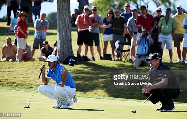 Brooks Koepka of the United States and Rod Pampling of Australia wait on the ninth green during the final round of the Shriners Hospitals For...