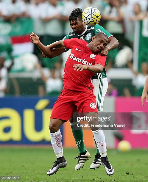 Thiago Santos of Palmeiras fights for the ball with Anderson of Internacional during the match between Palmeiras and Internacional for the Brazilian...