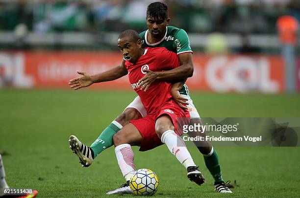 Thiago Santos of Palmeiras fights for the ball with Anderson of Internacional during the match between Palmeiras and Internacional for the Brazilian...