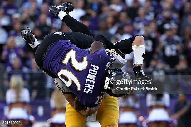 Cornerback Jerraud Powers of the Baltimore Ravens attempts to sack quarterback Ben Roethlisberger of the Pittsburgh Steelers in the fourth quarter at...