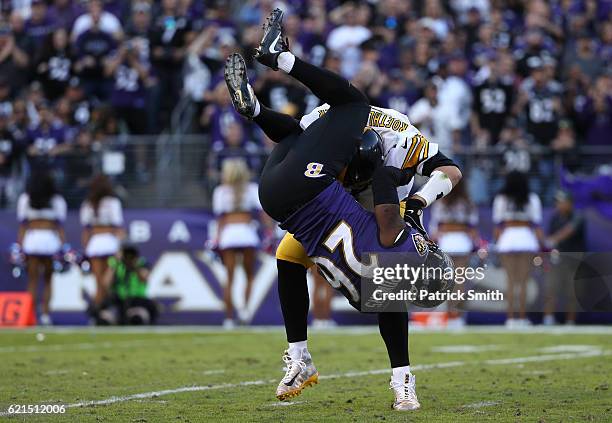 Cornerback Jerraud Powers of the Baltimore Ravens attempts to sack quarterback Ben Roethlisberger of the Pittsburgh Steelers in the fourth quarter at...