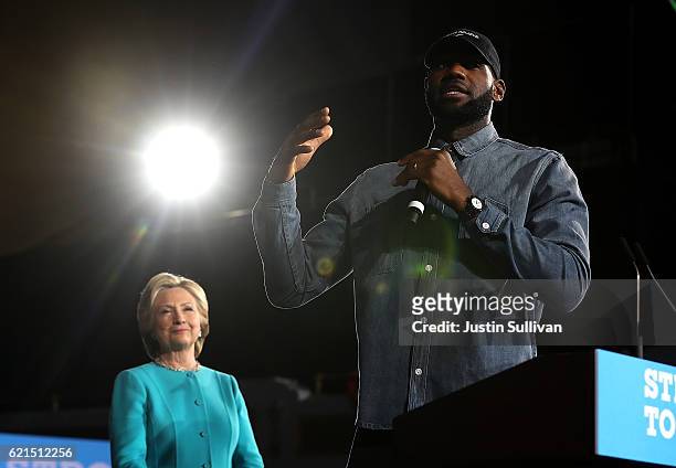 LeBron James speaks as Democratic presidential nominee former Secretary of State Hillary Clinton looks on during a campaign rally at the Cleveland...