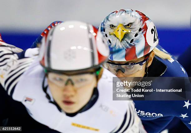 Suk Hee Shim of Korea is chased down by Jessica Kooreman of the United States in the women's 1000 meter quarter final during the ISU World Cup Short...