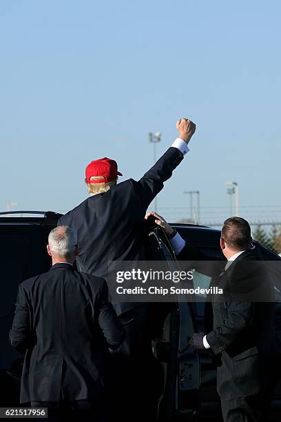 Republican presidential nominee Donald Trump waves to an overflow crowd from his vehicle at the conclusion of a campaign rally in the Sun Country...