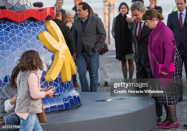 Gallo Worldwide CEO Pedro Cruz and Portuguese artist Joana Vasconcelos read the plaque at the sculpture's base during the inauguration of Pop Galo,...