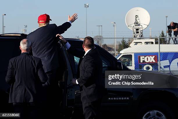 Republican presidential nominee Donald Trump waves to an overflow crowd from his vehicle at the conclusion of a campaign rally in the Sun Country...