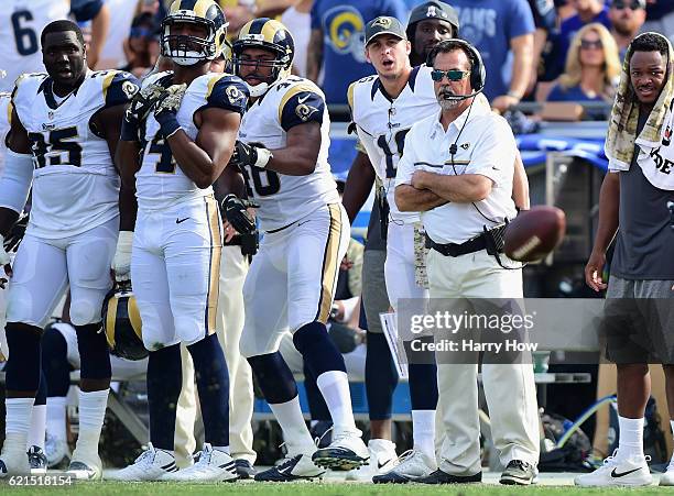 Head coach Jeff Fisher of the Los Angeles Rams watches his team during the second quarter of the game against the Carolina Panthers at the Los...