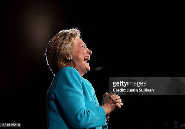 Democratic presidential nominee former Secretary of State Hillary Clinton laughs during a campaign rally at the Cleveland Public Auditorium on...